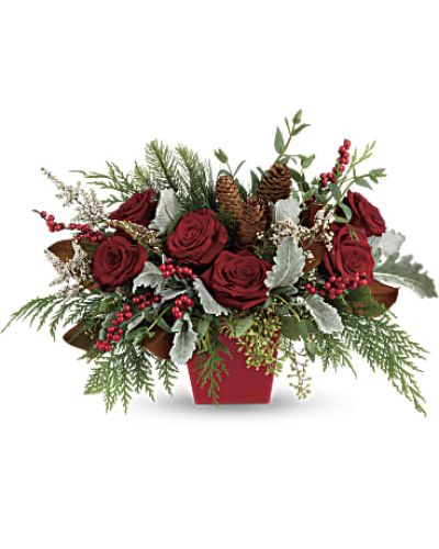 <p>Deck the halls, and table, with this artisanal mix of winter greens, berries and roses, artfully arranged in a tapered red cube.</p>